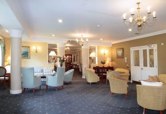 Comfortable lounge area with seating and decor at Alston Court