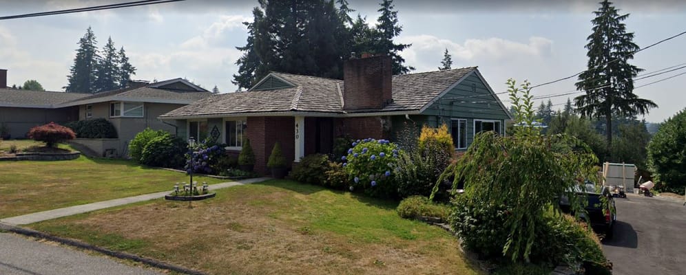 View of the exterior of Amy's Adult Care Home with landscaping