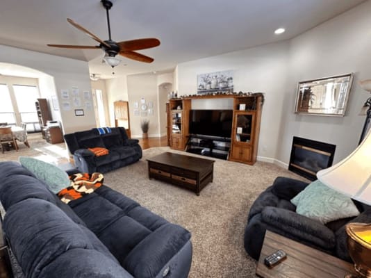 Cozy common area with comfortable seating and a fireplace