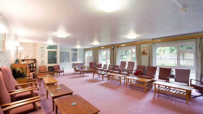 A spacious common area with seating for residents