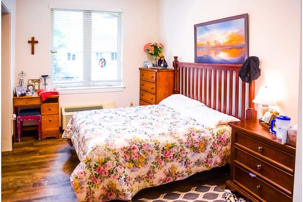 Cozy resident room with floral bedding
