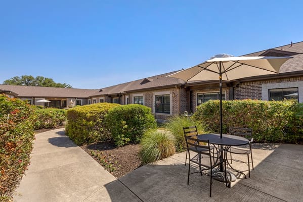 Outdoor seating area with gardens and walkways