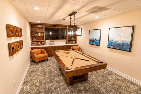 Interior view of a game room with a billiards table