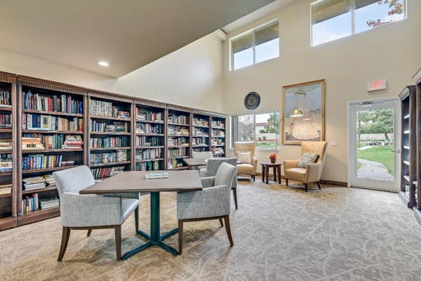 Comfortable seating and bookshelves in the Arcadia Place library