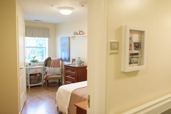 A cozy resident room with warm lighting and personal touches