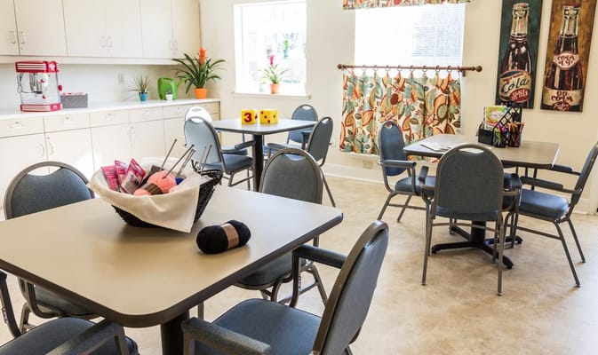 Bright common area with tables and chairs