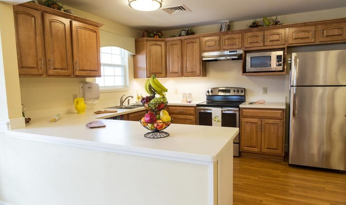 Bright kitchen area with fresh fruits displayed
