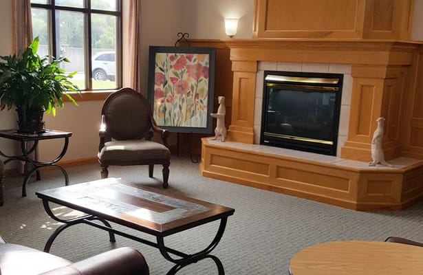Cozy common area with seating and a fireplace