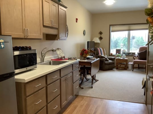 Interior view of a resident's apartment with a kitchen and living area