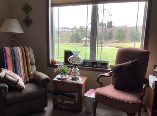 Cozy lounge area with chairs and window view