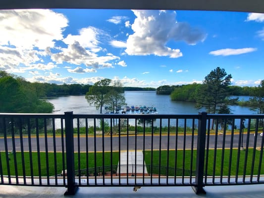 View from a balcony overlooking a serene lake