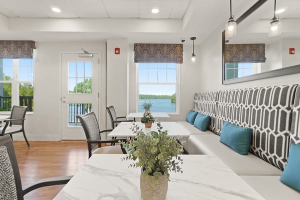 Bright dining area with a view of the water
