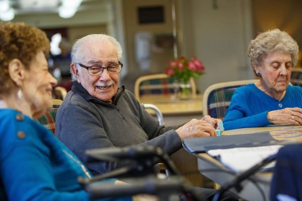 Residents engaged in conversation at a common area