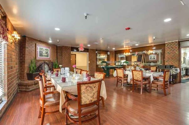 Dining area with tables set for a meal