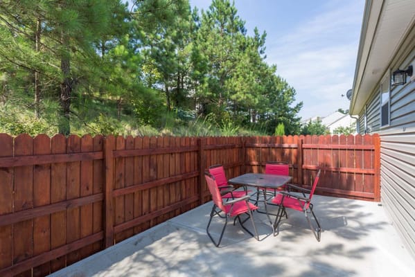 Outdoor patio area with table and chairs