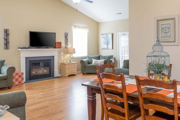 Interior common area with seating and a fireplace