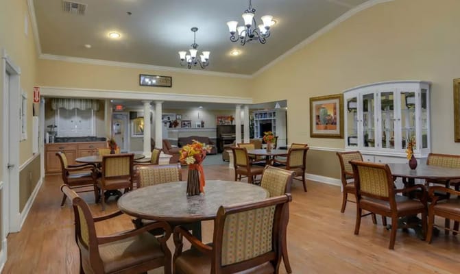 Bright dining area with tables and chairs at Azalea Court Senior Living