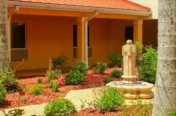 Garden area with a fountain and flowering plants