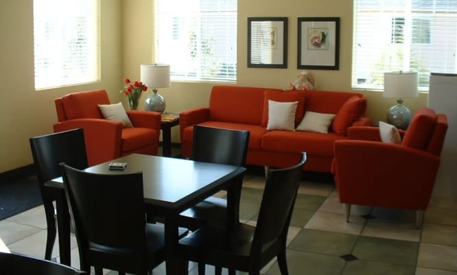 Bright interior lounge area with orange furniture