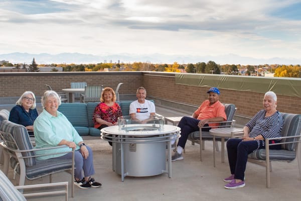 Residents enjoying time together on a rooftop terrace