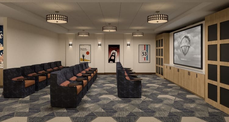 Comfortable lounge area with seating and a large screen