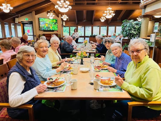 Residents enjoying a meal in the dining room