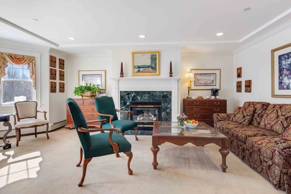 Cozy common area with seating and a fireplace