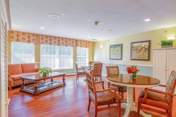 Bright common area with seating and floral decor