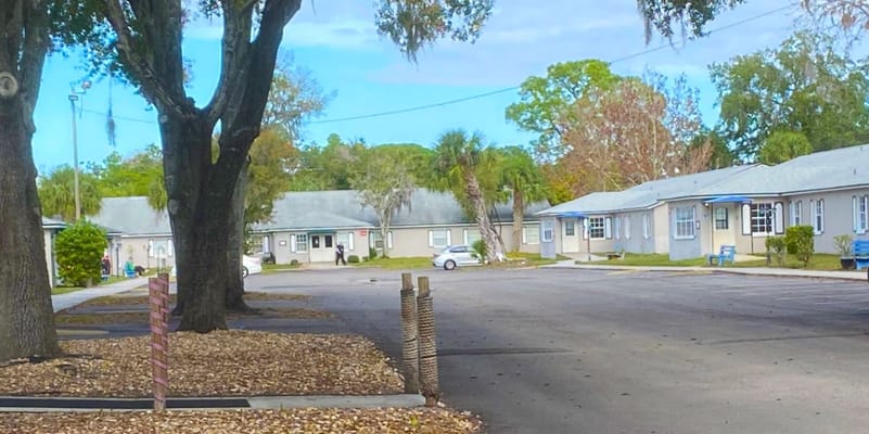 Outdoor view of a senior living facility with parking spaces