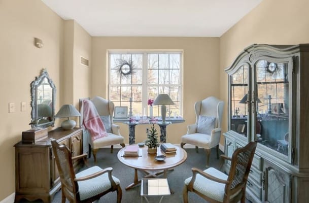 A cozy common area with comfortable seating and natural light