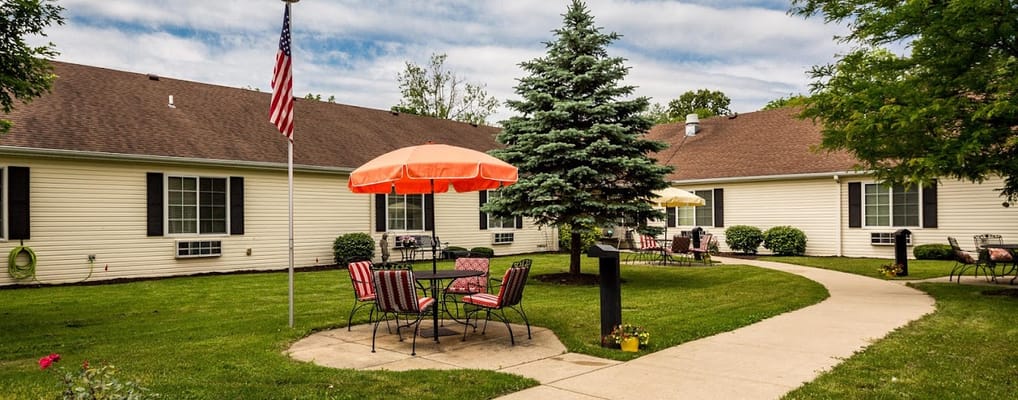 Outdoor seating area with umbrellas and trees