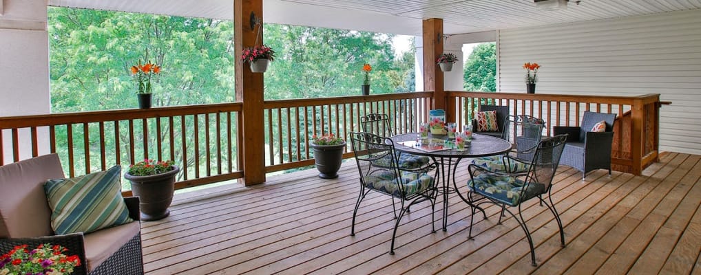 Outdoor patio area with seating and potted plants