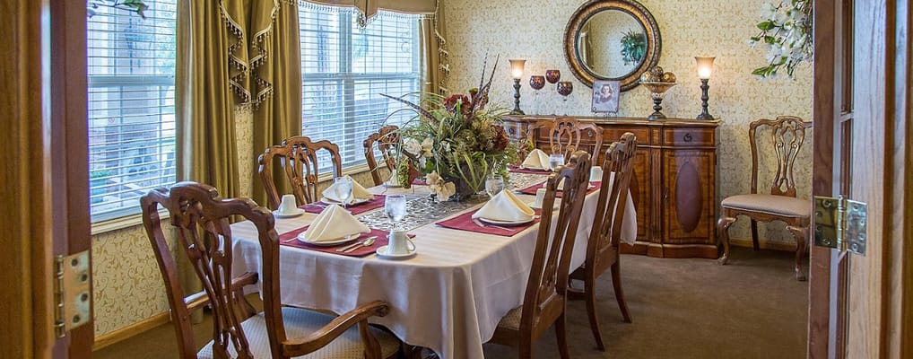 Elegant dining room with a large table set for a meal