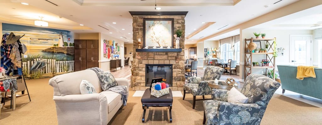 Common area with comfortable seating and a fireplace