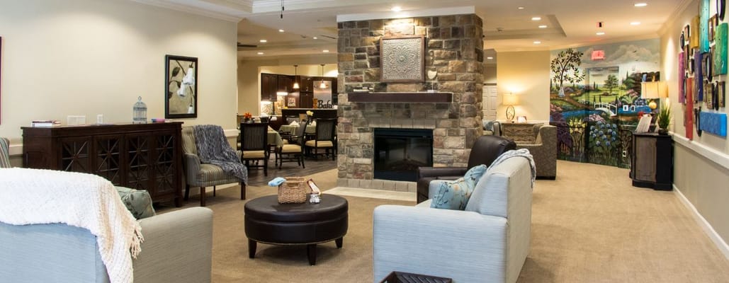 Cozy lounge area with stone fireplace and seating
