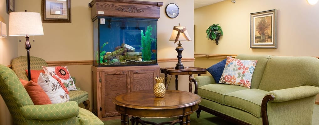Cozy common area with seating and an aquarium