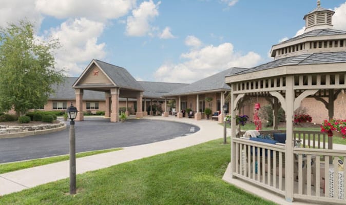 Exterior view of assisted living facility with gazebo