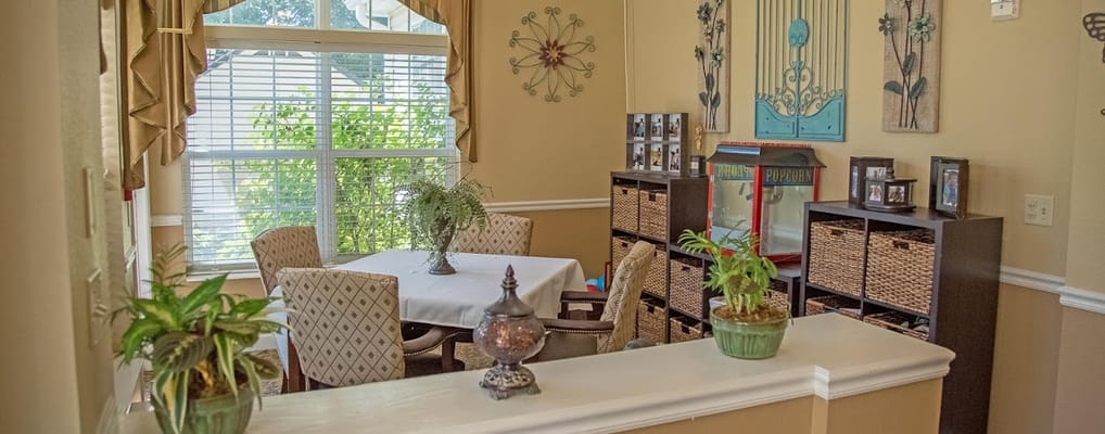 Common area with plants and a dining table