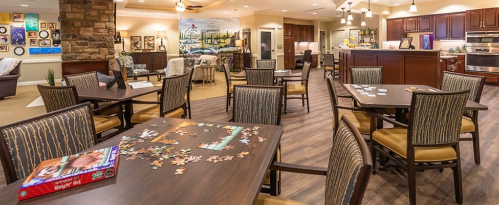 Common area with tables and puzzle activity