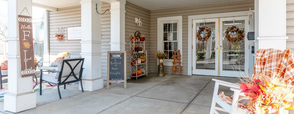 Welcoming entrance with seasonal decor and seating