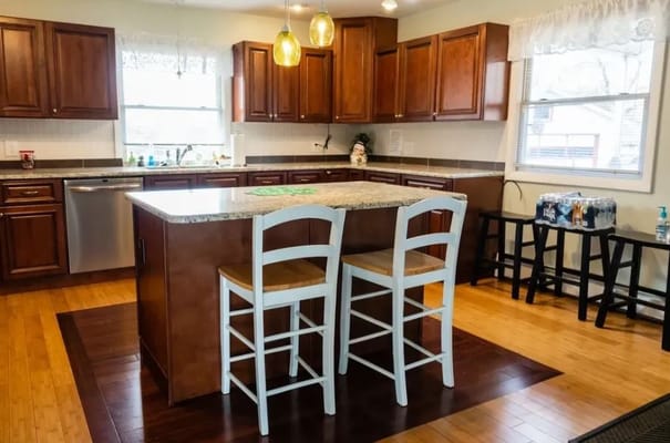 Bright kitchen area with wooden cabinets and island