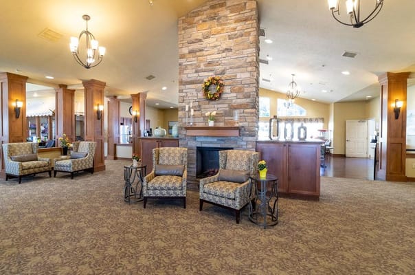 Interior common area with cozy seating and a fireplace