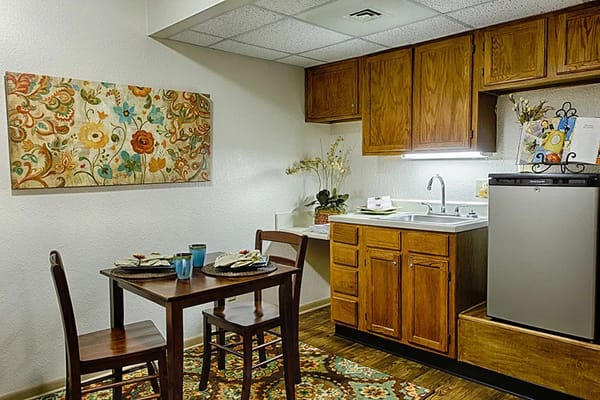 A cozy kitchenette area in a senior living facility