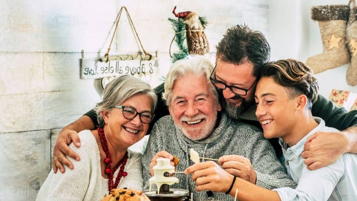 A family enjoying a dessert together at a festive gathering