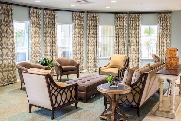 Cozy common area with seating and decorative curtains