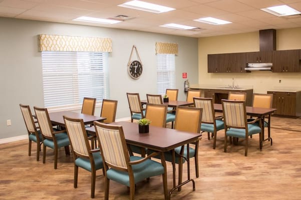 Bright common area with tables and chairs