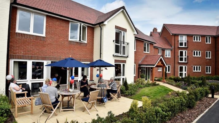 Residents enjoying time outside in the garden area