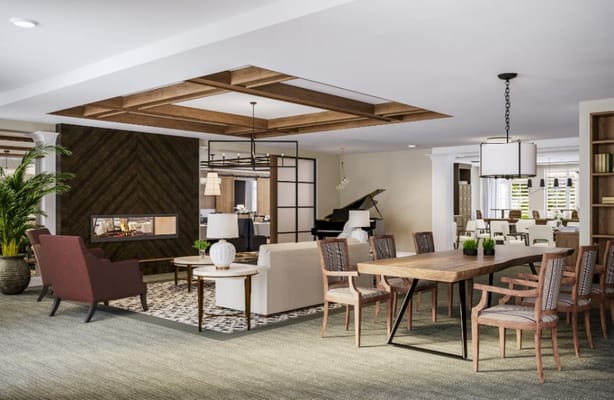 Bright and inviting common area with seating and dining