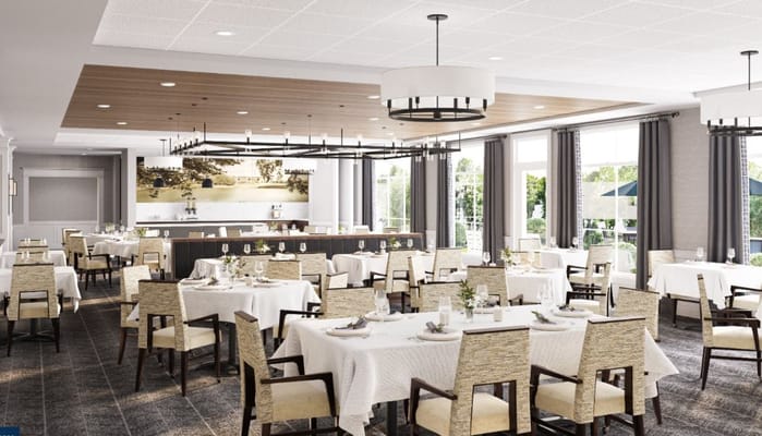 Bright dining room with tables set for meals