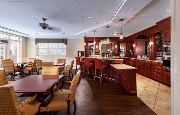 Bright dining area with seating and bar